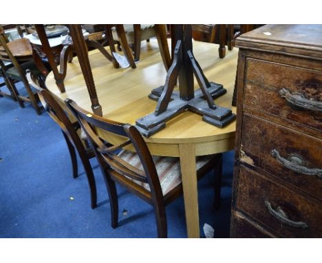 A MODERN LIGHT OAK FINISH EXTENDING DINING TABLE, approximate size extended width 166cm x depth 115cm x height 24cm and eight