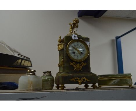 A FRENCH ONYX MANTEL CLOCK, with gilt cherub and detail, 'Savoye.DLNIS' on face (key), together with two onyx table lighters 