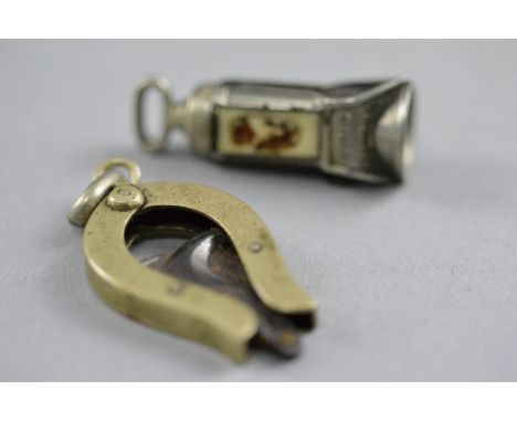 AN ENAMEL CIGAR CUTTER, and another (2)