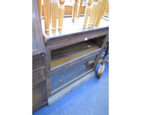 AN OAK SECTIONAL TWO TIER BOOKCASE, with glazed fall front doors, approximate size width 87cm x height 88cm x depth 35cm (mis