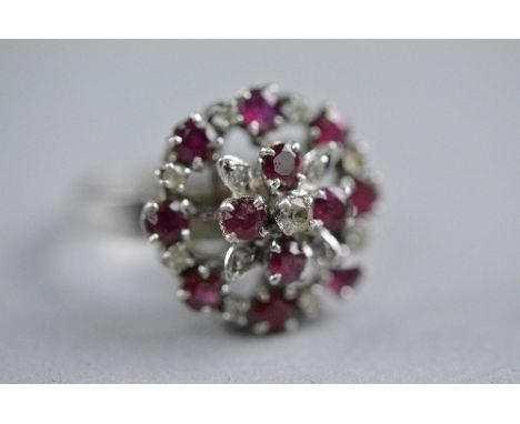 AN 18CT WHITE GOLD RUBY AND DIAMOND CLUSTER RING, ring size O, approximate weight 5.3 grams