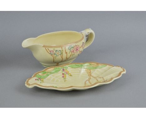 CLARICE CLIFF FOR NEWPORT POTTERY GRAVY BOAT, together with Clarice Cliff for Wilkinson Pottery Honey glaze dish of similar p