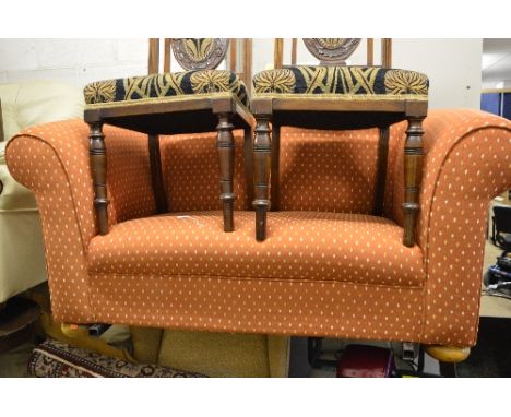 AN UPHOLSTERED TWO SEATER SOFA