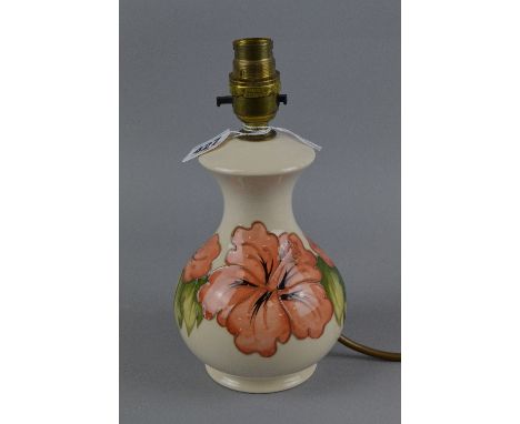A MOORCROFT POTTERY LAMP BASE, Hibiscus pattern, impressed and painted marks to base, height approximately 17cm (not includin