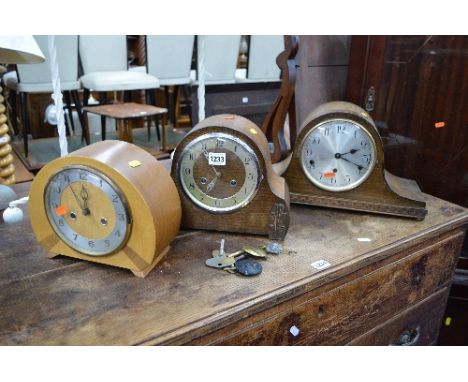 TWO OAK CASED MANTLE CLOCKS, and a walnut Smiths mantle clock (three pendulums and three winding keys) (3)