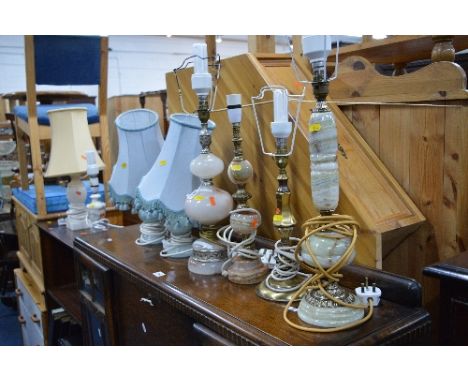 SEVEN VARIOUS ONYX AND MARBLE TABLE LAMPS, and a brass table lamp (8)