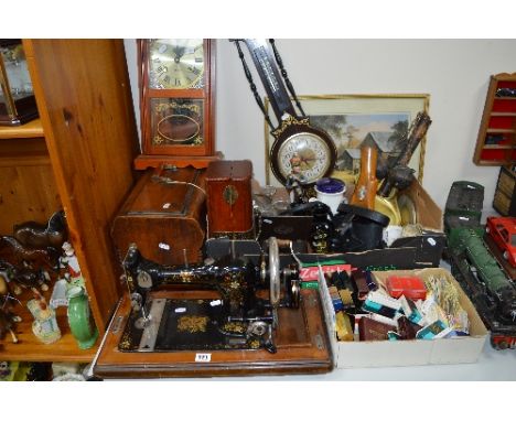 A FEDERATION TABLE TOP SEWING MACHINE, together with two boxes of sundries, wall clock, barometer, marbles, Prinz binoculars,