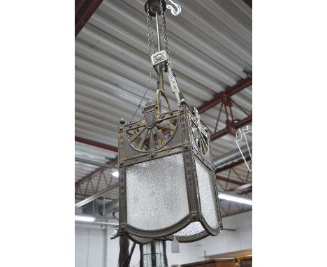 A FRENCH BRASS ART DECO CENTRE HANGING LIGHT FITTING, of a square form with textured frosted panels, approximate height 110cm
