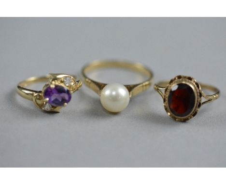 THREE MIXED 9CT DRESS RINGS, ring size K, M and T, approximate weight 8 grams