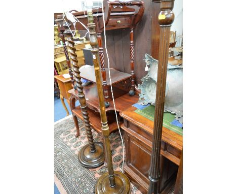 AN OAK BARLEY TWIST STANDARD LAMP, and two mahogany standard lamps (3)