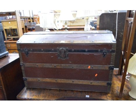 A VINTAGE DOMED TOPPED TRUNK, with metal and wooden banding, J. Ingram refs, Trunk & Bag Depot, 54 St Mary's Street, Cardiff 