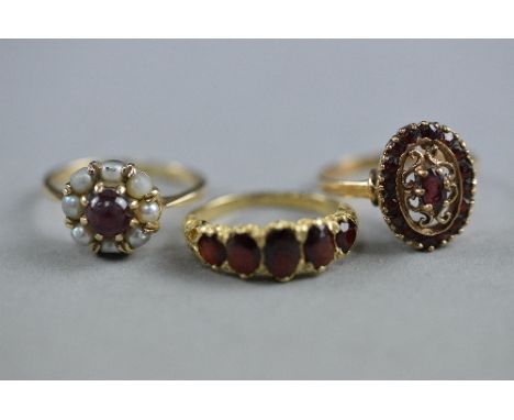 THREE 9CT GARNET SET DRESS RINGS, ring sizes K, P & N, approximate weight 7.4 grams