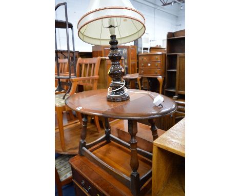 AN OAK DROP LEAF OCCASIONAL TABLE, a folding three tier cake stand and a ceramic table lamp (3)