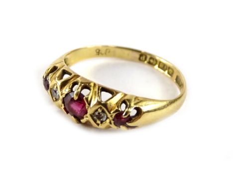 An 18ct gold ruby and diamond ring, with each stone in claw setting, diamonds set in diamond shaped borders, Birmingham 1892,