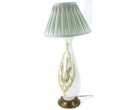 A Continental white opaque glass lamp base, decorated with wheat within a gilt cartouche on a brass effect base, with pleated