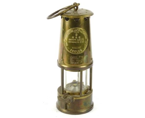 A brass protector miners lamp, with original plaque etc., type 6, 23cm H.