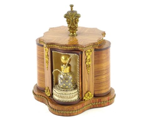 A Continental Kingwood dressing table stand, with gilt metal mounts, the revolving finial moving part cylindrical compartment