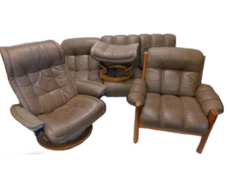 A vintage retro style Stressless type suite of furniture, comprising three seater sofa, armchair, swivel chair and footstool,