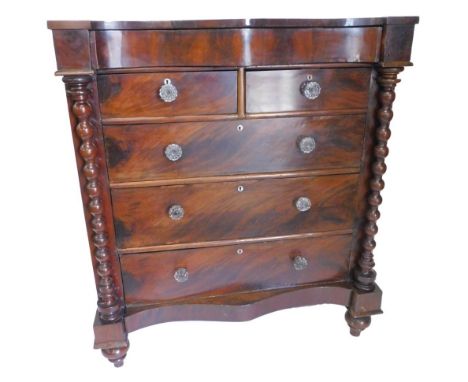 A Victorian mahogany Scottish type large chest of drawers, the serpentine fronted top with a frieze drawer, above two short a