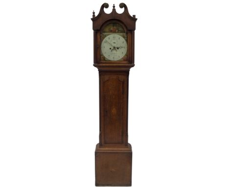 An early 19thC oak longcase clock, with swan neck and fluted pillared hood, full length crossbanded trunk door, with oval she