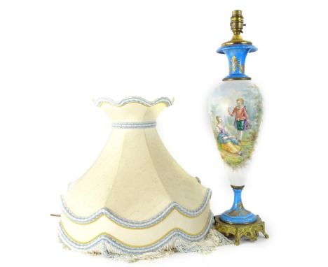 A late 19thC Sevres style porcelain lamp base, painted with French style figures, on a white ground, indistinctly signed, wit