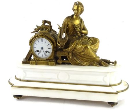 A 19thC French gilt brass figural mantel clock, the enamel dial seated between two books and a female harpist figure on a sto