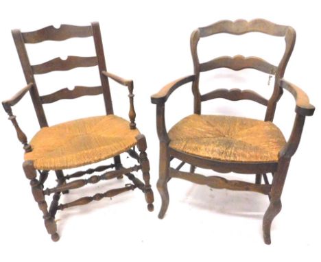 Two 19thC continental country made armchairs, each with a shaped ladder back a rush seat etc. (AF)