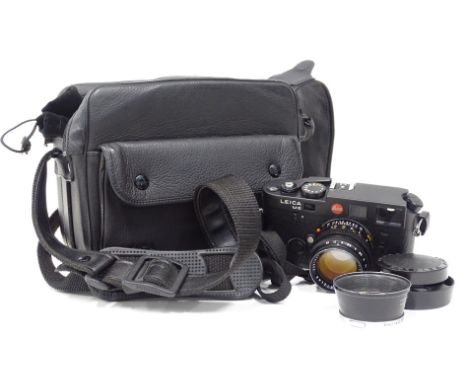 A Leica M6 camera body, fitted with a Leitz Sh-lux 1:1.4/50 lens, with a bag, etc.