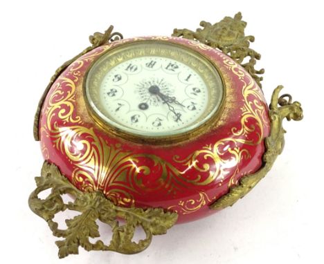 A late 19th/early 20thC French hanging Cartel type timepiece, the red ceramic case decorated in gilt and mounted with gilt me