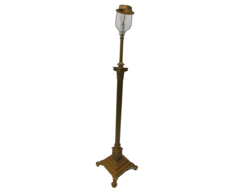 An early 20thC Corinthian column standard lamp, later painted in gold, on ball and claw feet, 163cm H.