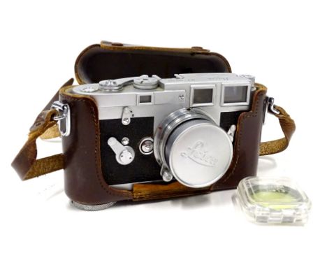 A vintage Leica Ernst Leitz camera, M3-857092, in brown leather case with Summicron f=5cm1:2 lens, 9cm H.