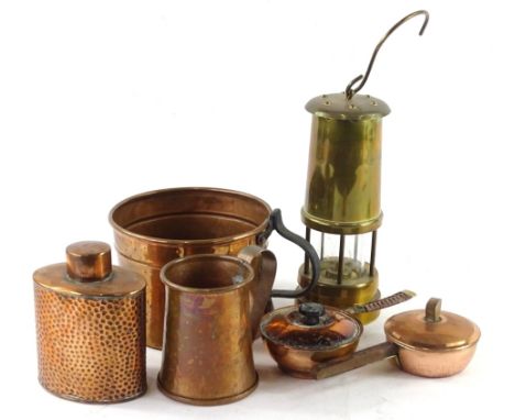 Miscellaneous metalware, to include a brass miners lamp, Arts and Crafts style hammered copper tea caddy, etc.