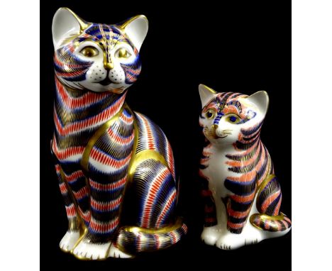 A Royal Crown Derby Imari cat, with silver button, and a Royal Crown Derby kitten, gold button, 13cm and 9cm high.