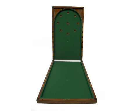 A Victorian panelled mahogany folding table top bagatelle, with baize lined interior.