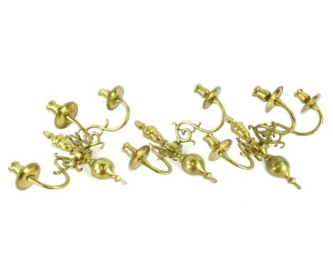 A pair of three branch Dutch style wall lights, and a two branch wall light.