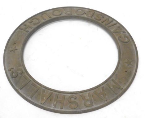 A cast brass steam or traction engine roundel, stamped Marshalls Gainsborough, 55cm dia.