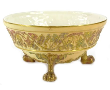 A Grainger Worcester blush ivory bowl, decorated in relief with leaves, scrolls etc., on paw feet, 17.5cm dia.