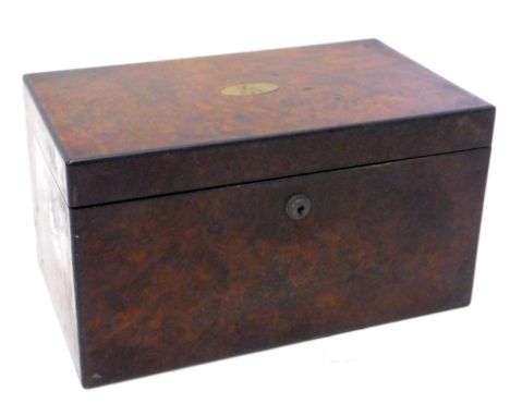 A Victorian figured walnut tea caddy, the rectangular hinged lid applied with a brass engraved cartouche, enclosing two foil 