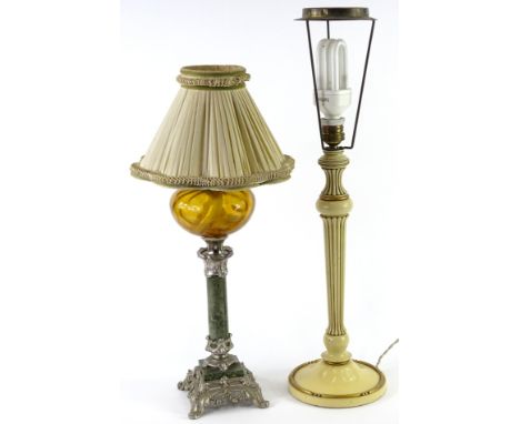 A Continental table lamp, modelled in the form of an oil lamp, with an amber tinted glass reservoir, marble column and silver