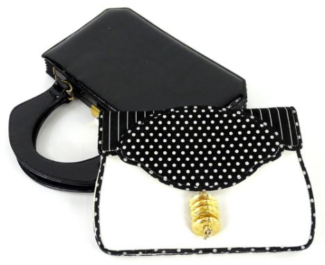 Two vintage Susan Gail handbags, to include a black patent leather top handle bag and a black and white shoulder bag with pol