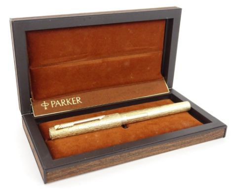 A Parker fountain pen, limited edition, made to commemorate the Royal Wedding 1981, in a wood effect case.