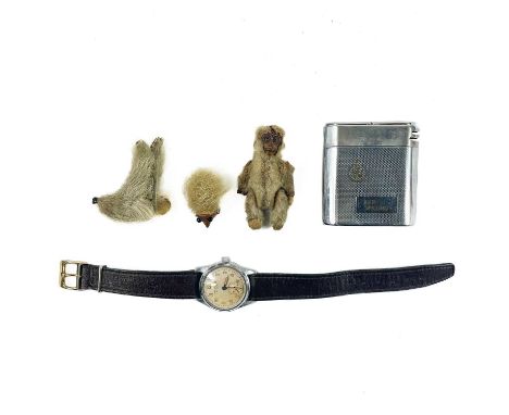 Aeroplane Atlanta Swiss made wristwatch. Together with German lighter and small fur toy figures.