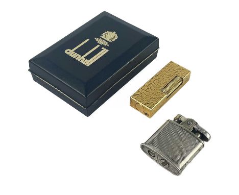 A Dunhill gold plated lighter. In presentation box, and a part silver Ronson lighter. (2)