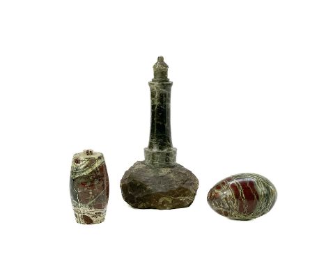 A Cornish serpentine turned model lighthouse. On a rocky mound base, height 18cm, together with a serpentine lidded barrel fo