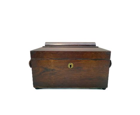 An early Victorian rosewood tea caddy. Of sarcophagus form, internally fitted with two lidded compartments, width 35cm.