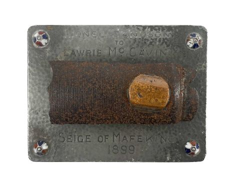 Shrapnel presentation from the Siege of Mafeking 1899. On a metal and enamel base, inscribed "Lionel Handson to Lawrie McGavi