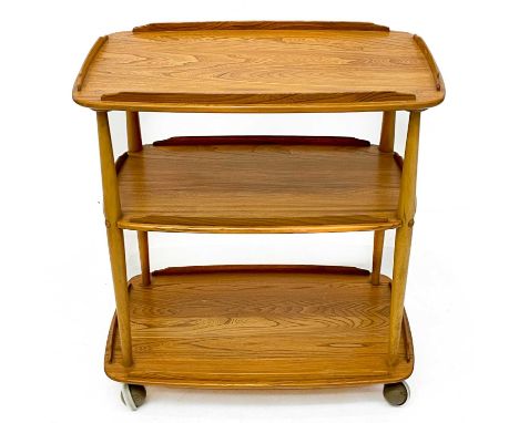 An Ercol Windsor light elm three tier trolley with lipped edges. Height 76.5cm, width 66cm depth 42.5cm.