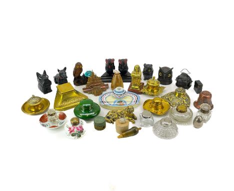 A large collection of various inkwells. Including several brass examples, carved Black Forests and ceramic inkwells. (30)