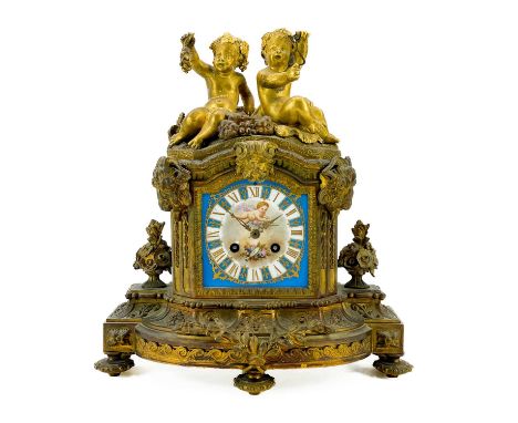 A French ormolu mantel clock. Circa 1880, with Sevres style porcelain panels, mounted with two cherubs, the movement by W Opp