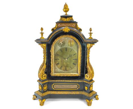 A late 19th century Benson of London ebonised bracket clock. With gilt metal mounts decorative pineapple and flame finials on